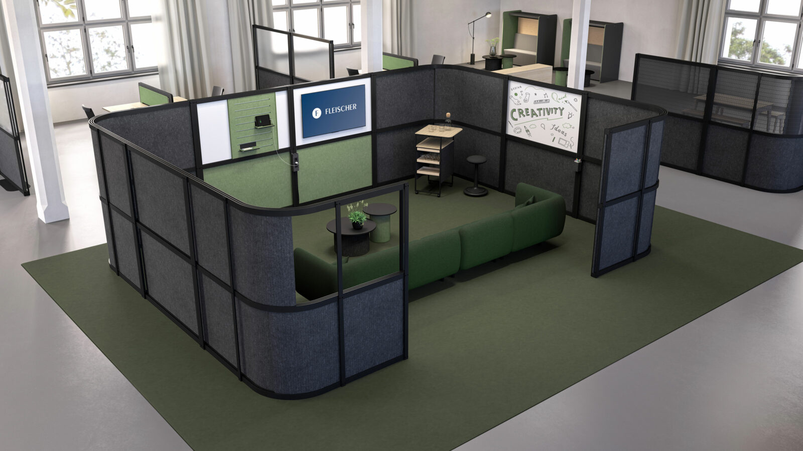 Open Space Bürolandschaft mit einem durch Stellwände abgetrennten Work Lounge Bereich mit Sofa